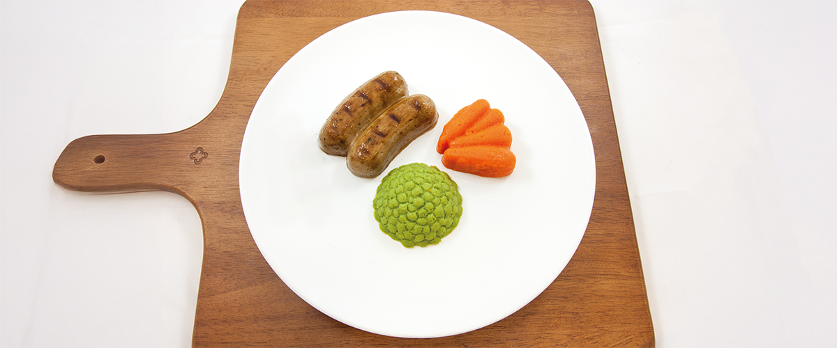 Shape It Pork, Herb and Honey Pureed Sausages with pureed Peas and Carrots